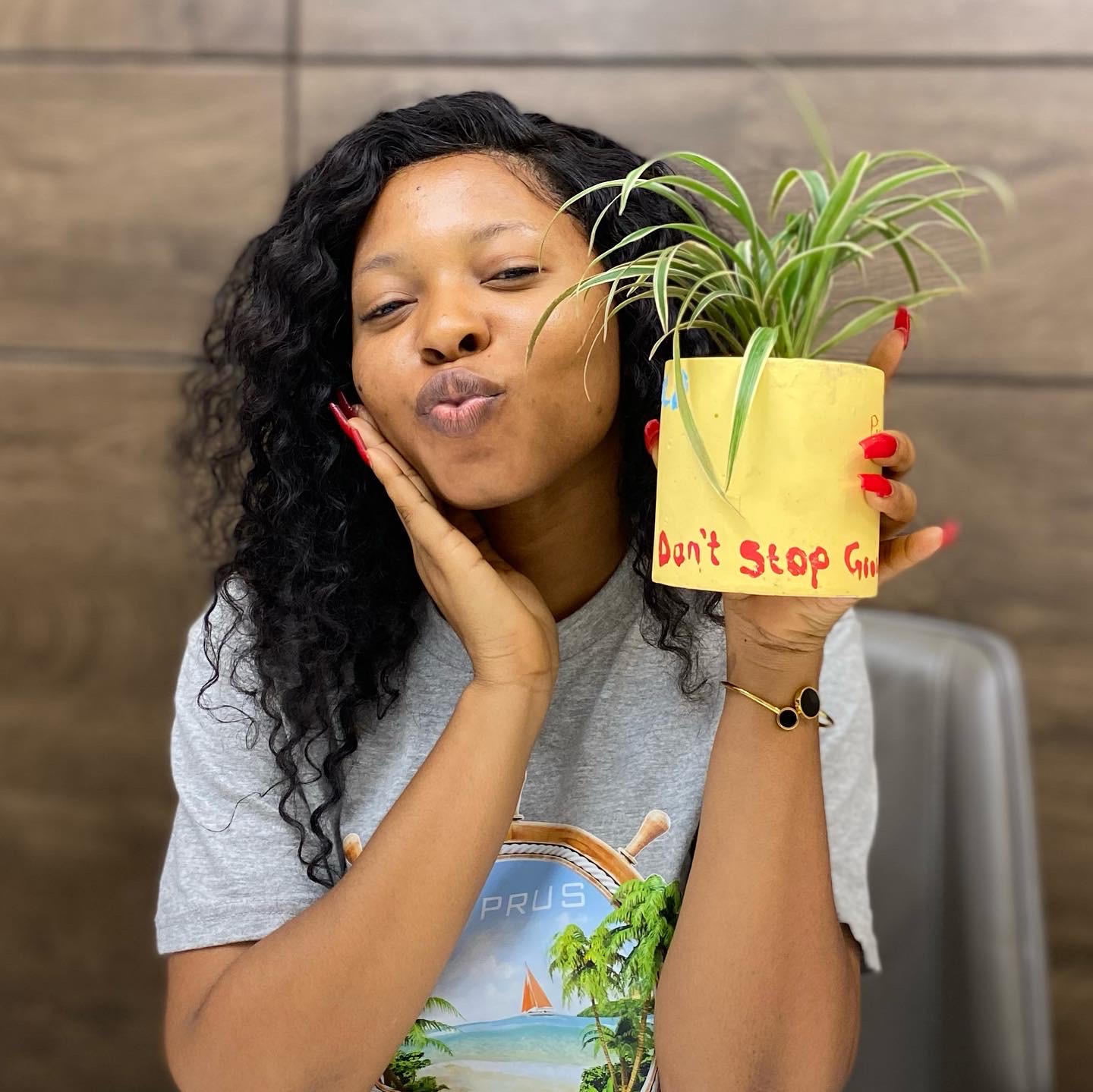 Young African woman with plants